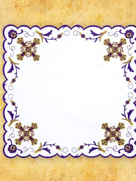 Decorative napkin with purple and gold patterns.