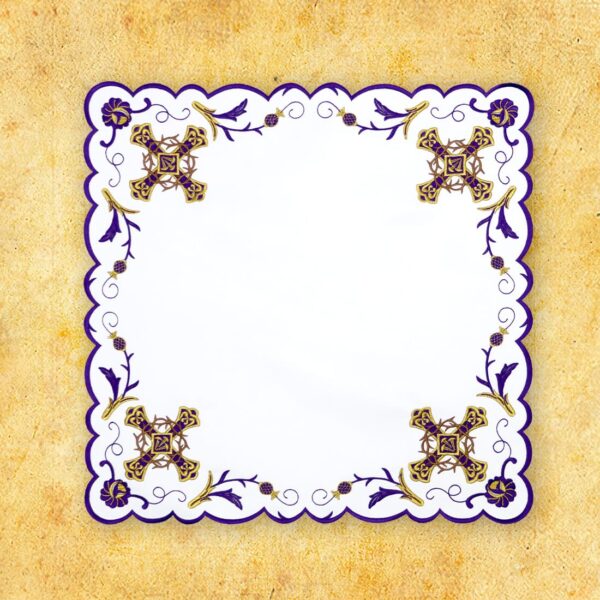 Decorative napkin with purple and gold patterns.
