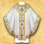 Ornamental white chasuble with golden embroidery.